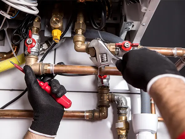 plumber fixing central heating system